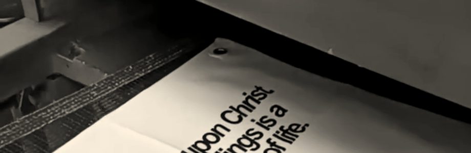 Printed canvas banners coming out of a conveyor dryer