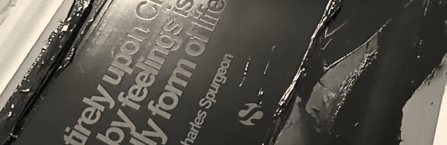 Black ink spread across a screen, with the squeegee at the top