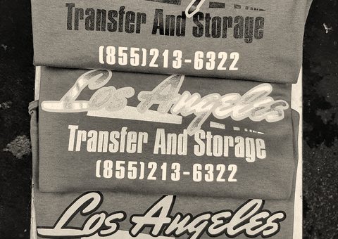Grey t-shirts with a company name printed in yellow, white and black