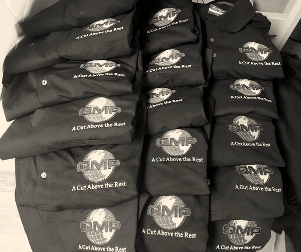 Embroidered company polos, stacked and ready for pickup