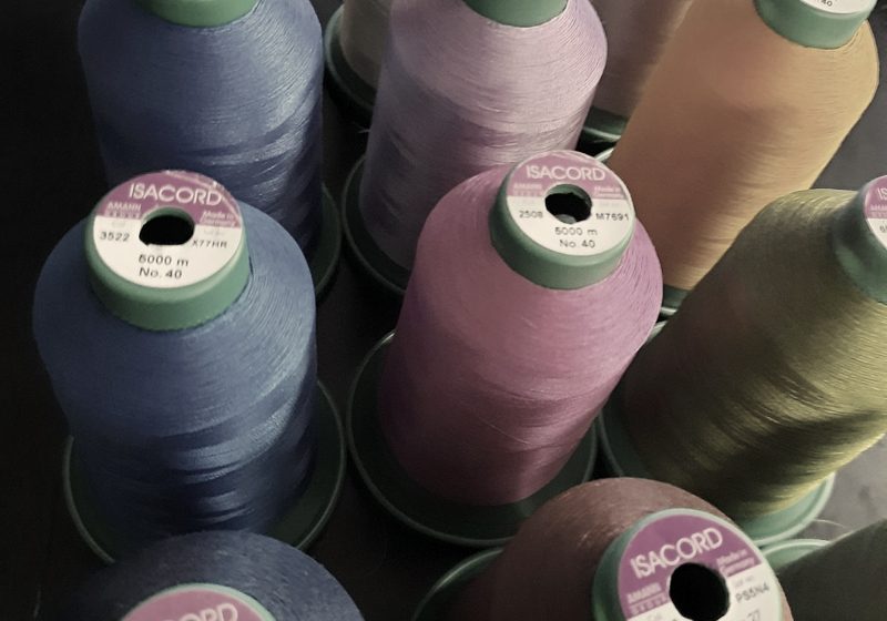 Cones of embroidery thread in many colors in the MMM Embroidery shop